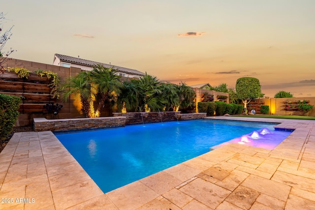 view of swimming pool featuring a fenced in pool, a patio area, and a fenced backyard