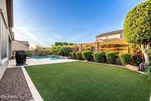 view of yard with a fenced backyard and a fenced in pool