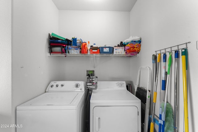 laundry area with washing machine and clothes dryer