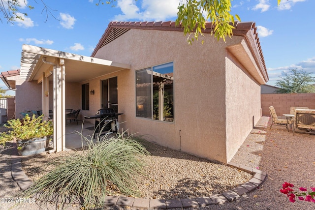 rear view of property featuring a patio