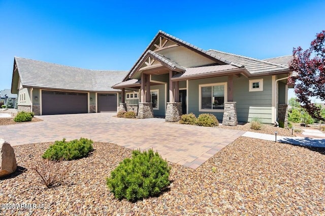 1568 Gettysvue Way, Prescott, AZ 86301 - craftsman inspired home featuring stone siding, an attached garage, and decorative driveway