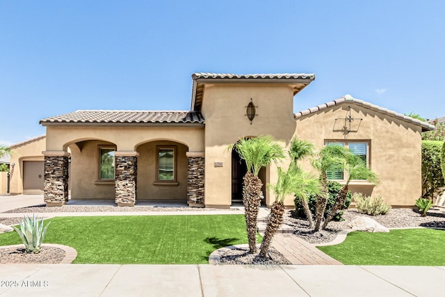 7242 W Rowel Rd, Peoria, AZ 85383 - mediterranean / spanish-style house featuring stucco siding, a front lawn, an attached garage, covered porch, and concrete driveway