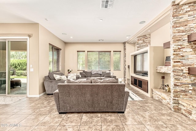 7242 W Rowel Rd, Peoria, AZ 85383 - living room with light tile patterned floors and recessed lighting