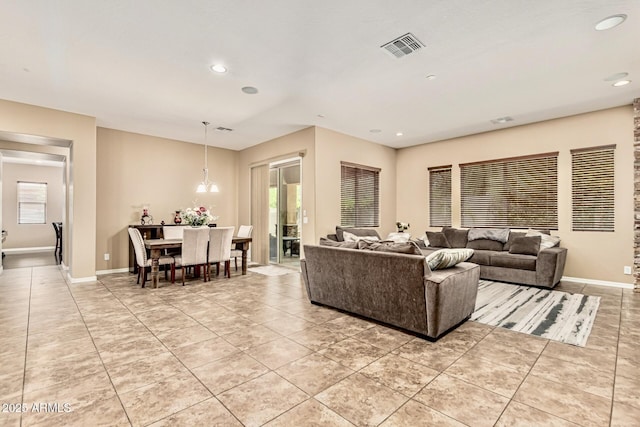 7242 W Rowel Rd, Peoria, AZ 85383 - living area with light tile patterned floors, recessed lighting, and plenty of natural light