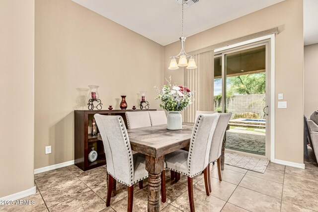 7242 W Rowel Rd, Peoria, AZ 85383 - dining space with a chandelier and light tile patterned floors
