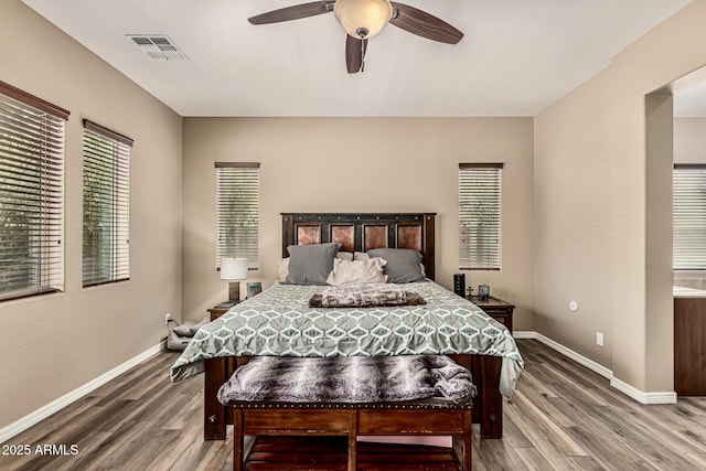 7242 W Rowel Rd, Peoria, AZ 85383 - bedroom with wood finished floors and a ceiling fan
