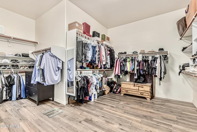 7242 W Rowel Rd, Peoria, AZ 85383 - walk in closet featuring wood finished floors