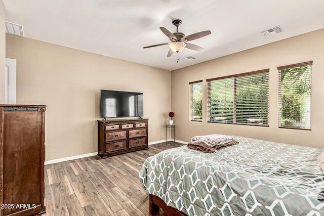 7242 W Rowel Rd, Peoria, AZ 85383 - bedroom with wood finished floors and ceiling fan