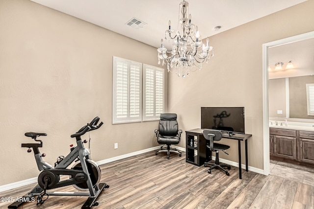 7242 W Rowel Rd, Peoria, AZ 85383 - office featuring wood finished floors and a chandelier