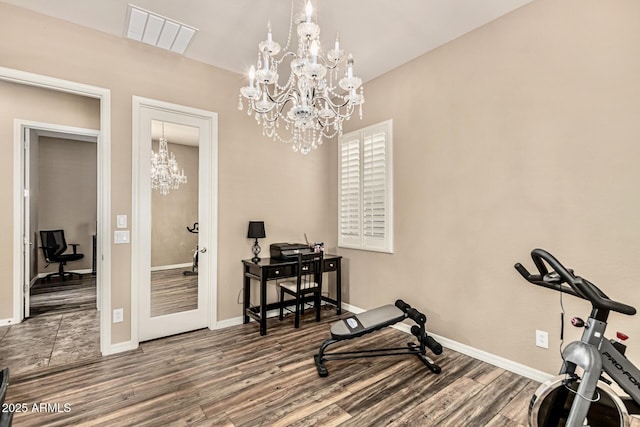 7242 W Rowel Rd, Peoria, AZ 85383 - exercise area with a chandelier and wood finished floors