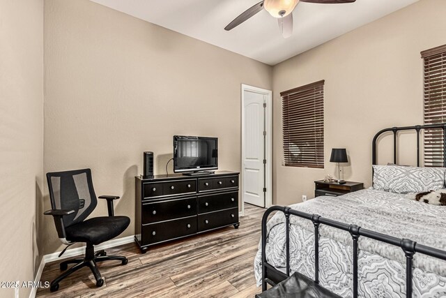 7242 W Rowel Rd, Peoria, AZ 85383 - bedroom with wood finished floors and ceiling fan