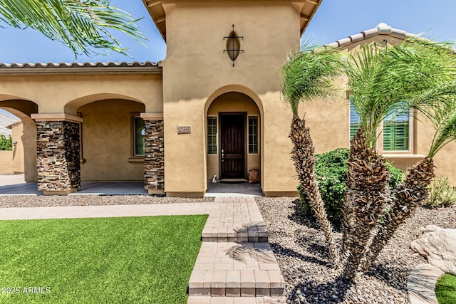 7242 W Rowel Rd, Peoria, AZ 85383 - property entrance featuring stucco siding and stone siding