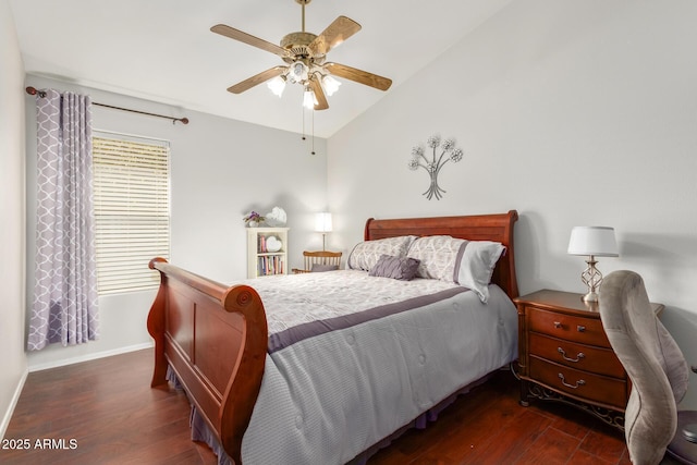 bedroom featuring ceiling fan, dark hardwood / wood-style floors, and lofted ceiling