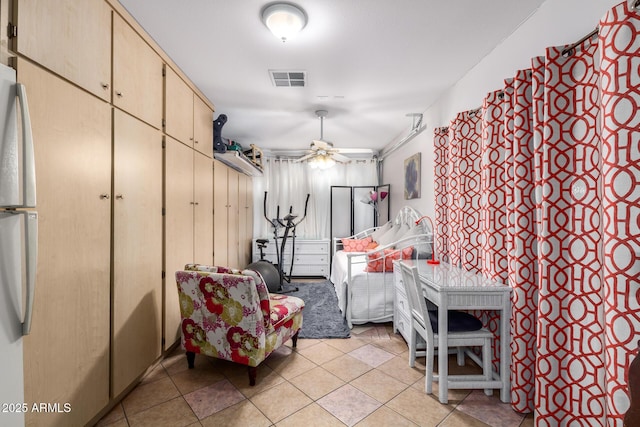 interior space with ceiling fan and light tile patterned floors