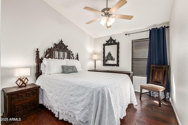 bedroom with vaulted ceiling, ceiling fan, and dark wood-type flooring