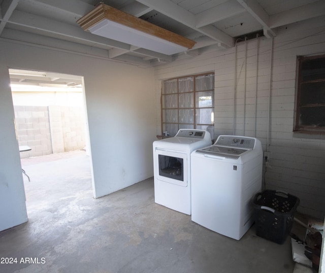 laundry area with independent washer and dryer