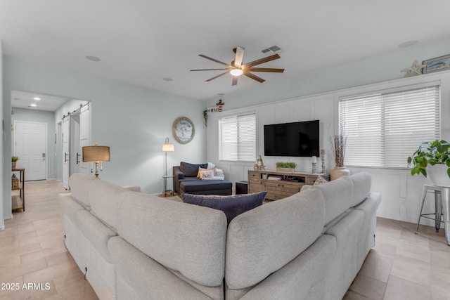 living area featuring ceiling fan