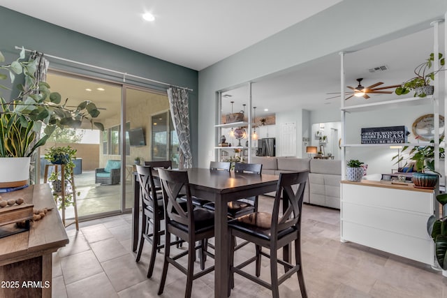 dining space with ceiling fan and recessed lighting