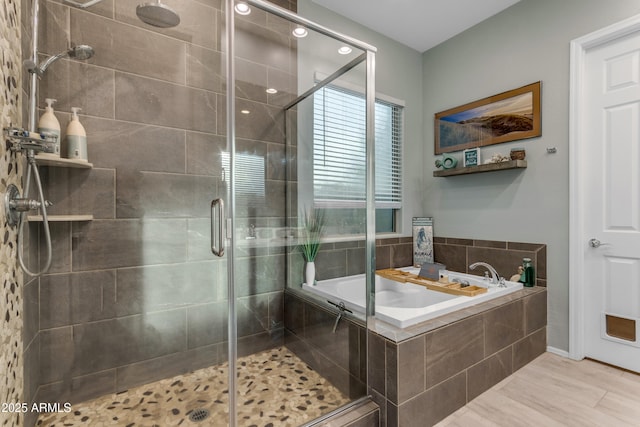 bathroom with a garden tub and a shower stall