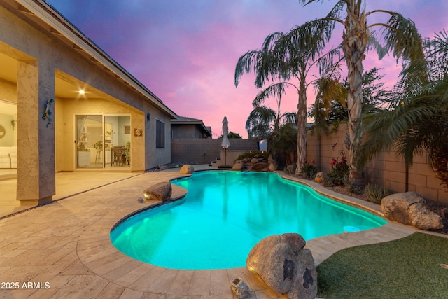 view of pool featuring a fenced backyard and a patio