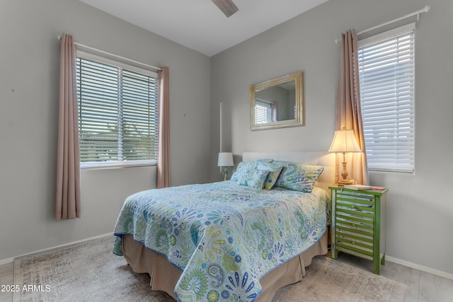 bedroom with baseboards and ceiling fan