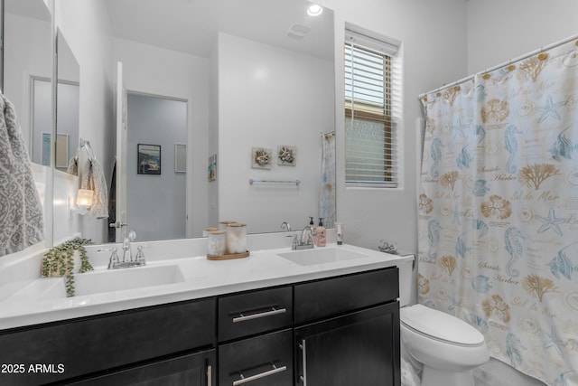 full bathroom with toilet, double vanity, and a shower with curtain