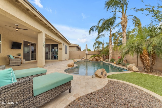 view of swimming pool featuring a fenced backyard, a patio, and ceiling fan