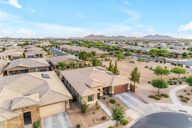 aerial view of residential area featuring a mountain backdrop