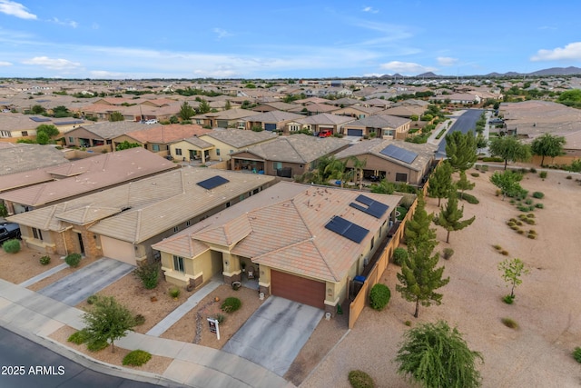 aerial view of residential area featuring a mountain backdrop