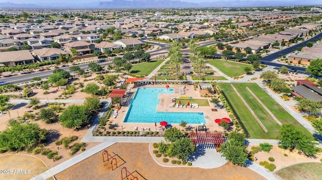 aerial view of a pool and mountains