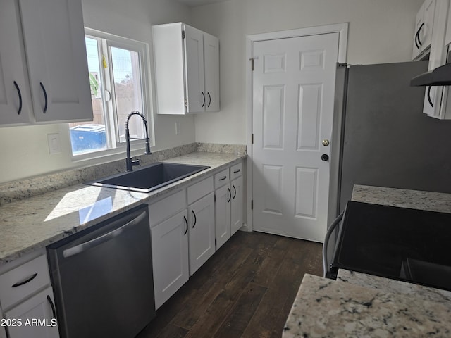 kitchen with sink, dark hardwood / wood-style floors, white cabinets, and appliances with stainless steel finishes