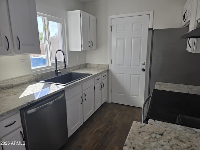 kitchen with white cabinetry, appliances with stainless steel finishes, sink, and dark hardwood / wood-style floors