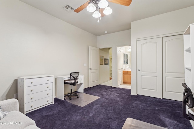 carpeted home office with ceiling fan