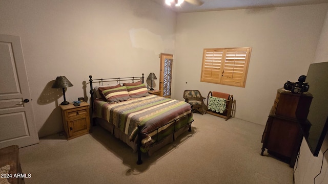 bedroom featuring ceiling fan and light carpet