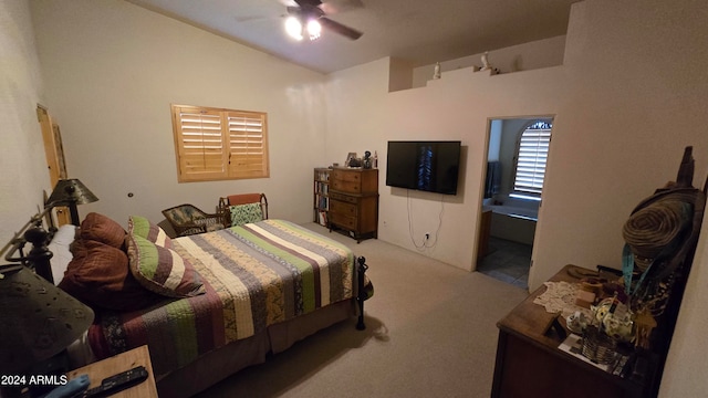 carpeted bedroom with ceiling fan and ensuite bath