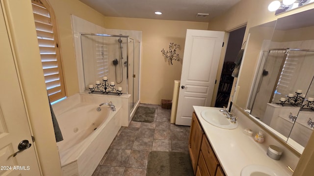 bathroom with plus walk in shower and vanity