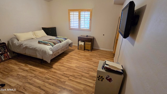 bedroom with light hardwood / wood-style flooring