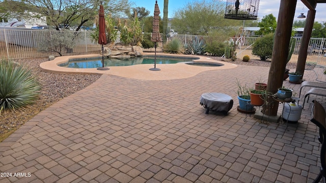 view of swimming pool with a patio area