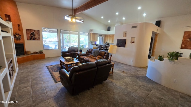 living room with beamed ceiling, dark tile patterned floors, high vaulted ceiling, and ceiling fan