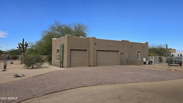 2926 W Tanya Trl, Phoenix, AZ 85086 - view of front of property featuring a garage, stucco siding, and decorative driveway