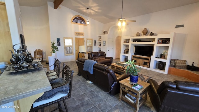 2926 W Tanya Trl, Phoenix, AZ 85086 - living area featuring arched walkways, a ceiling fan, built in features, and high vaulted ceiling