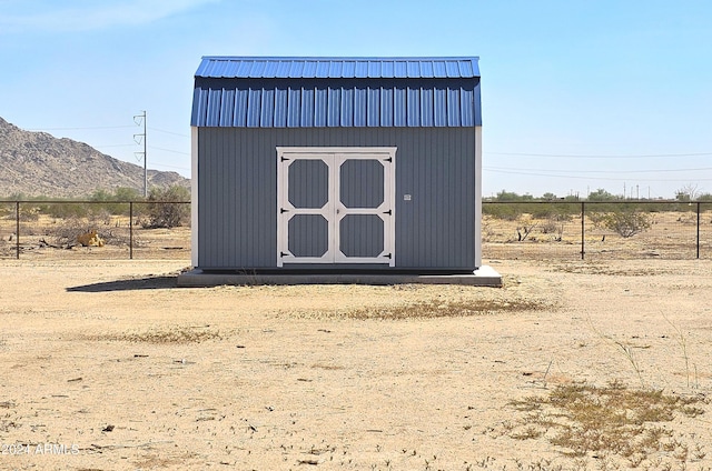 view of outbuilding with a mountain view