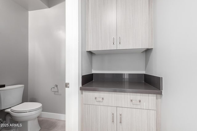 bathroom featuring tile patterned floors and toilet