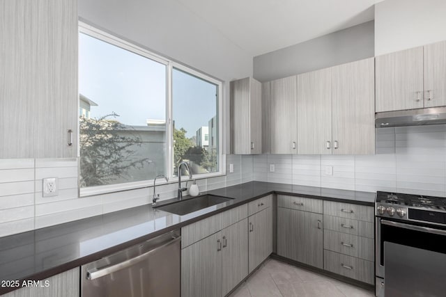 kitchen with decorative backsplash, wall oven, sink, light tile patterned floors, and dishwasher