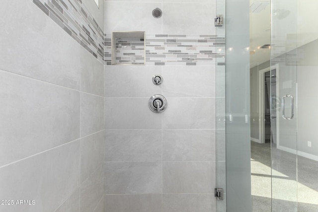 bathroom with a shower with shower door