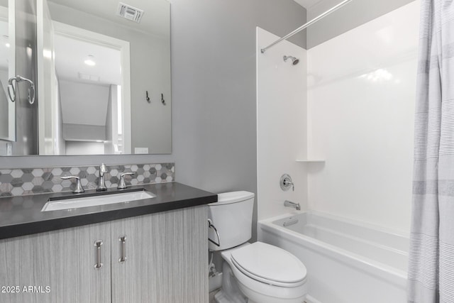 full bathroom with shower / tub combo, vanity, tasteful backsplash, and toilet