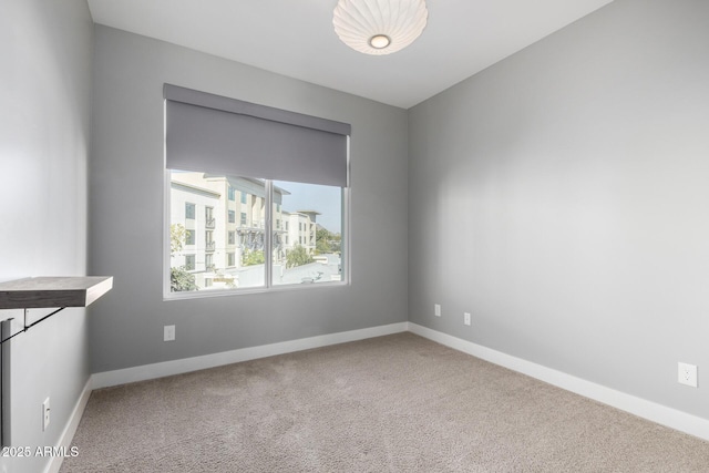 spare room featuring carpet flooring