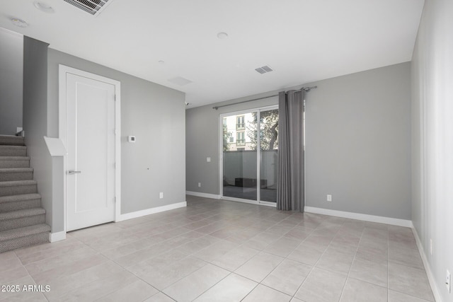 unfurnished room with light tile patterned floors