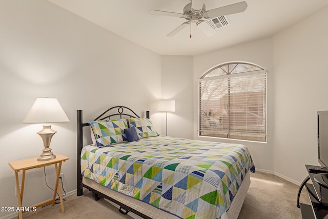 carpeted bedroom featuring visible vents, a ceiling fan, and baseboards