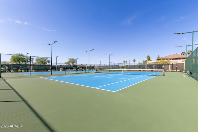 view of sport court with fence